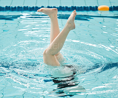 Swimming, athlete and legs in water upside down, exercise and training for healthy body. Pool, feet and person alone in synchronized workout, sport art and practice for fitness in wellness underwater