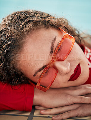 Buy stock photo Face, summer and sunglasses with a hipster woman closeup in a swimming pool for safety or style. Fashion, thinking and poolside with a young swimmer looking bored waiting alone in trendy eyewear