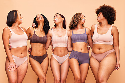 Buy stock photo Body positive, happy and women in studio in underwear for wellness, beauty and self love campaign. Diversity, natural skin and people in lingerie on brown background for confident, pride or inclusion