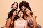 Diversity, beauty and portrait, group of women with self love and solidarity in studio together. Cosmetics on face, power people on beige background with underwear, skincare and makeup for equality.