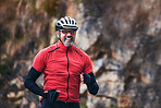 Cycling, mountain and excited mature man for exercise, training and workout goals in nature. Sports, travel and happy male cyclist with celebration for wellness, cardio and fitness for adventure