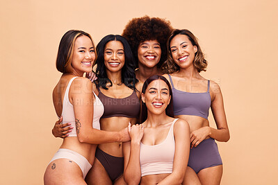Buy stock photo Body portrait, underwear and group of women in studio isolated on a brown background. Smile, lingerie and friends with empowerment, inclusion and positivity, natural beauty and wellness for diversity