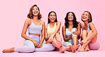 Portrait, friends and women with fitness, funny and pilates training on a pink studio background. Health, girls or friends with workout, laughing or athlete with wellness, relax, exercise and freedom