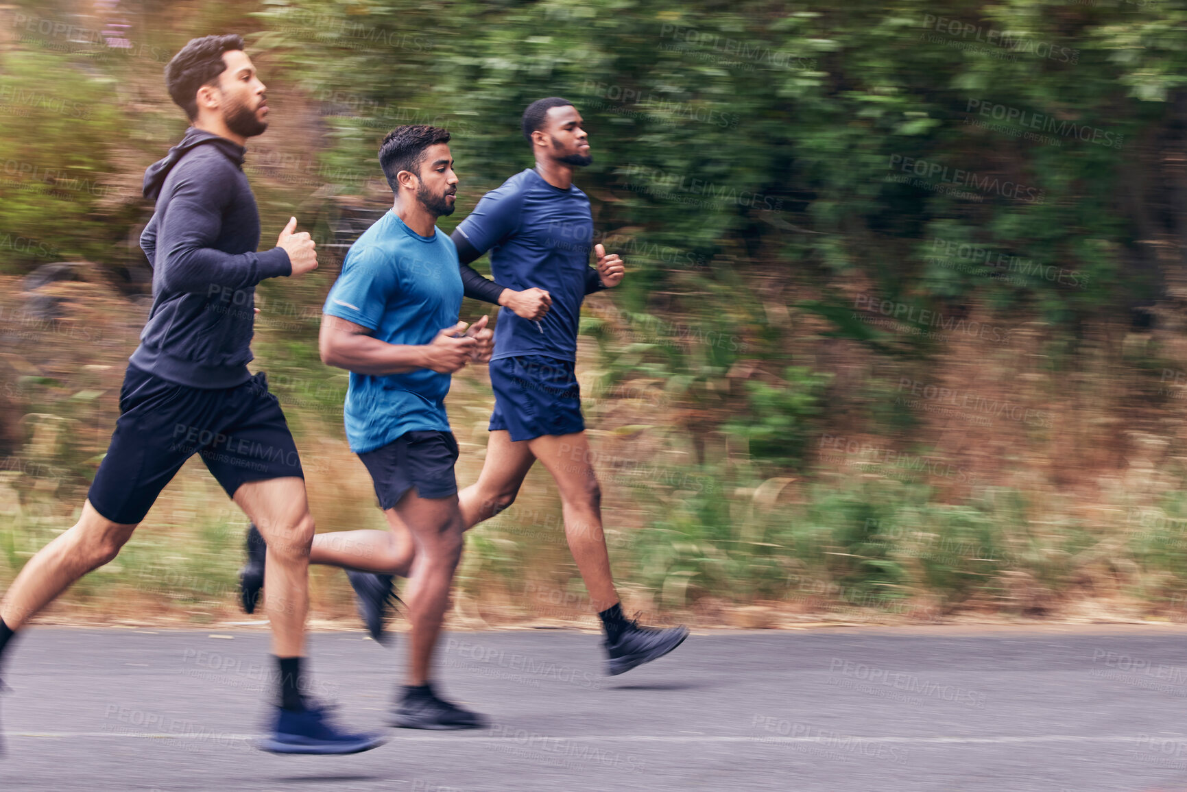 Buy stock photo Running, fitness and men in a road for training, speed and energy, health and cardio routine in nature. Sports, diversity and man friends on practice run for competition, workout or endurance goal