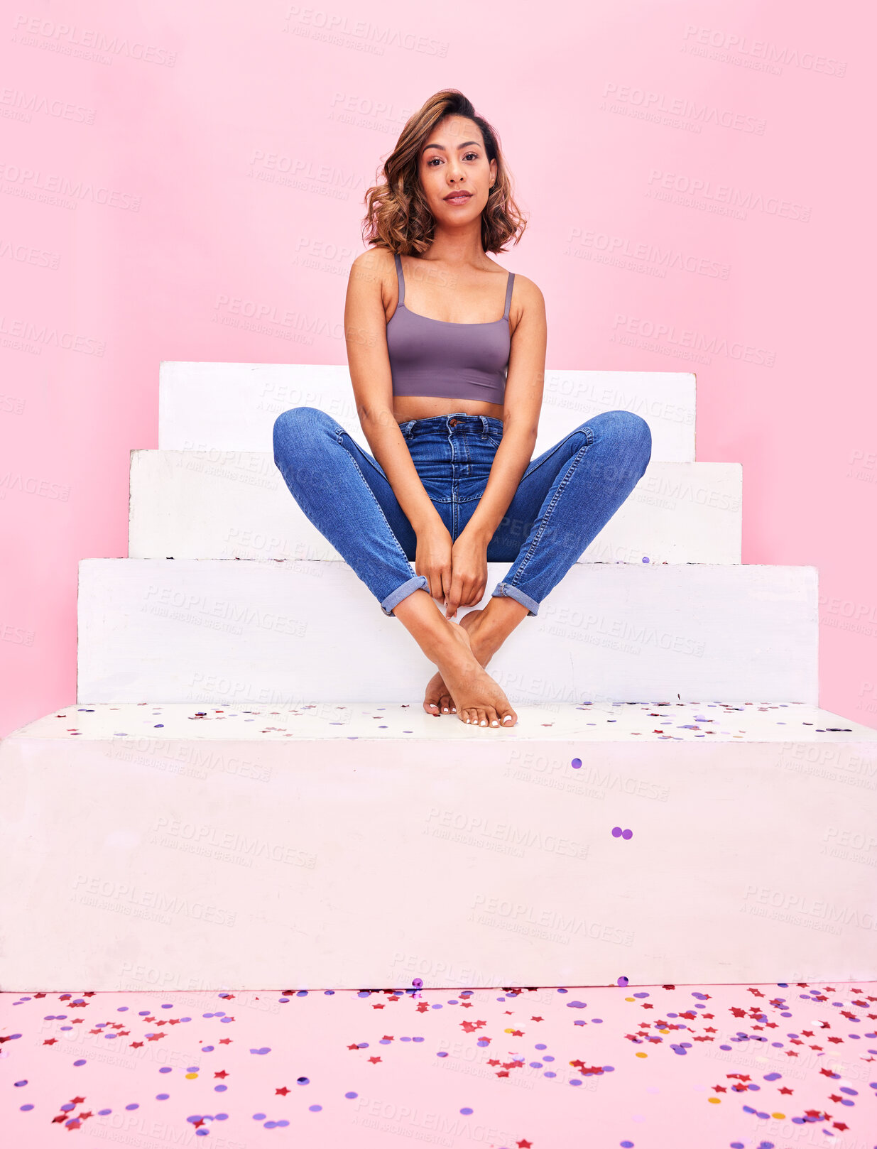 Buy stock photo Portrait, steps and woman with confetti, style and fashion with celebration on a pink studio background. Person, gen z or girl with sparkle, party or event with confident model or birthday decoration