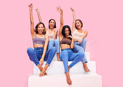 Buy stock photo Fashion, stairs and excited women in studio for clothing promotion, discount and retail sale. Friends, bonding and people cheer on pink background in denim outfit, trendy clothes and casual style