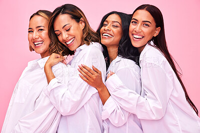 Buy stock photo Women, friends hug and portrait in studio with natural beauty, diversity and white shirt with laugh. Pink background, bonding and young female group together with inclusion, happy smile and wellness