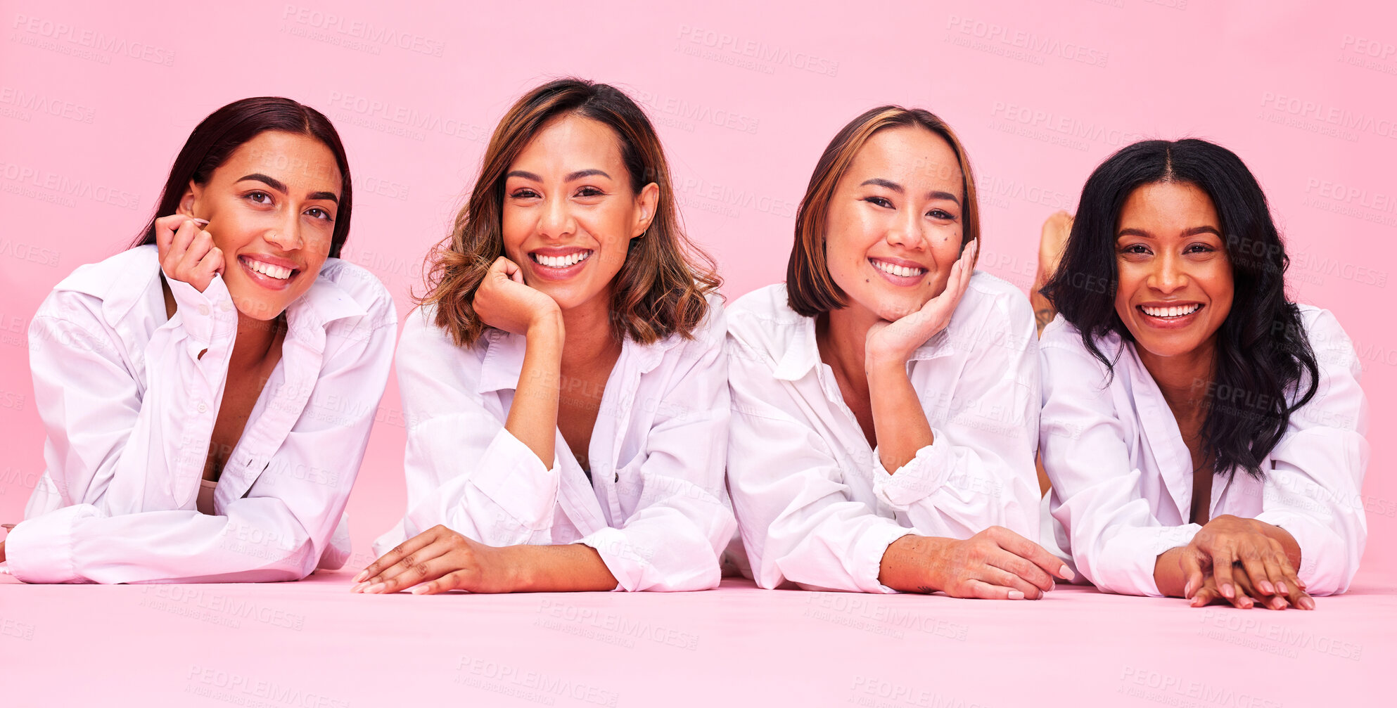Buy stock photo Portrait, smile and lingerie with woman friends on a pink background in studio for natural skincare. Diversity, beauty and wellness with a female model group posing for health, inclusion or cosmetics