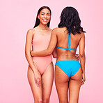 Bikini, fashion and portrait of friends with diversity, beauty and style of women in swimsuit on pink background in studio. Sexy, swimming costume and face of model with body confidence and support