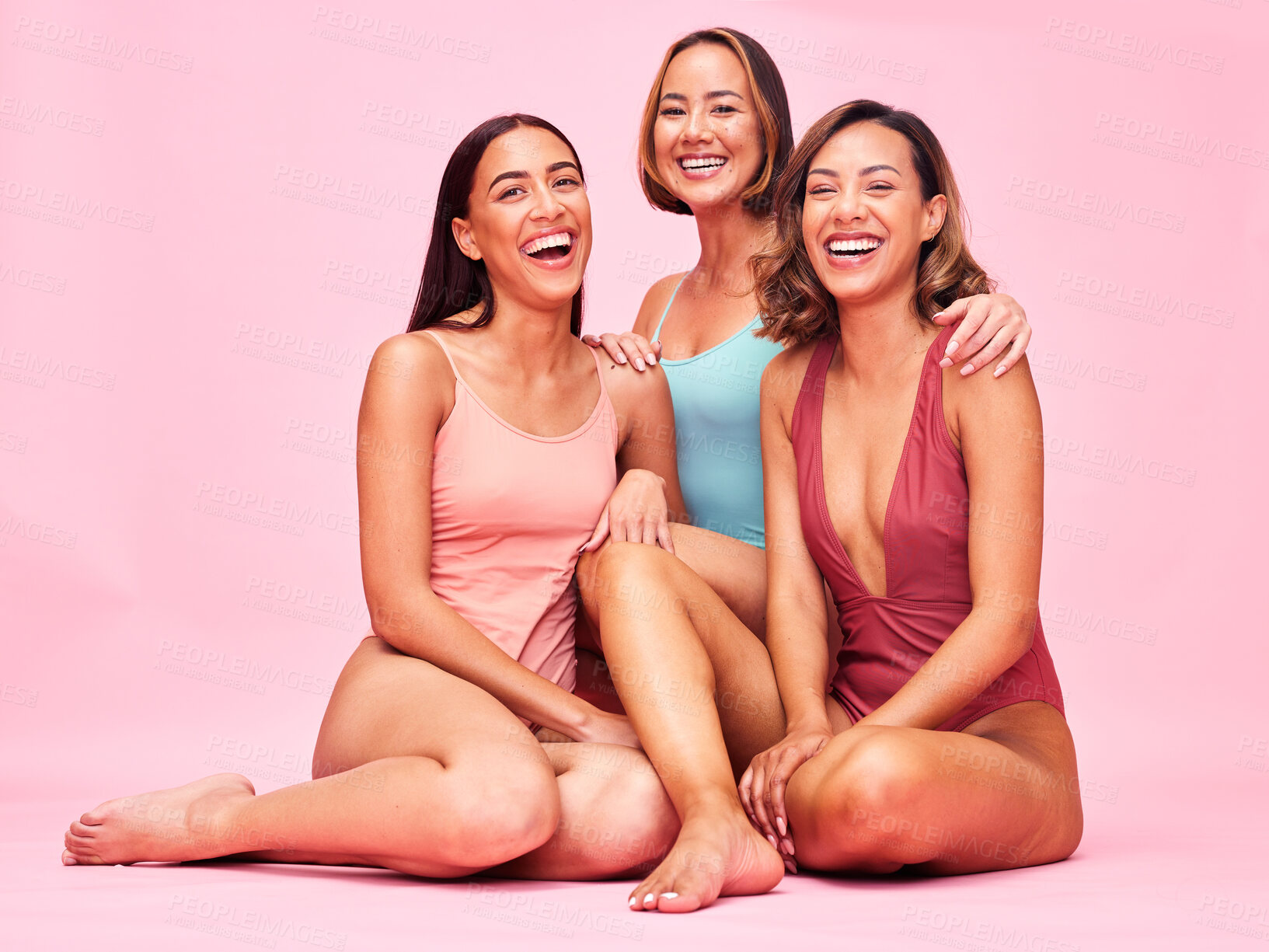 Buy stock photo Diversity, bikini and group of happy women in studio, sitting together with smile and body positivity. Beauty, fun summer fashion and swimwear models with self love, equality and pink background.