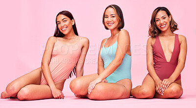 Buy stock photo Diversity, swimsuit and portrait of happy women in studio, sitting together with smile and body positivity. Beauty, summer fashion and bikini models with self love, equality and pink background.