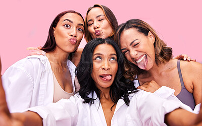 Buy stock photo Girl group, studio selfie and funny face with solidarity, diversity and happy for blog by pink background. Women friends, comic memory and smile for photography, memory and post on social network
