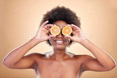 Buy stock photo Orange fruits, skincare and woman on studio background for natural cosmetics, healthy benefits and nutrition. Happy african beauty model cover eyes with citrus for vitamin c, detox or eco dermatology