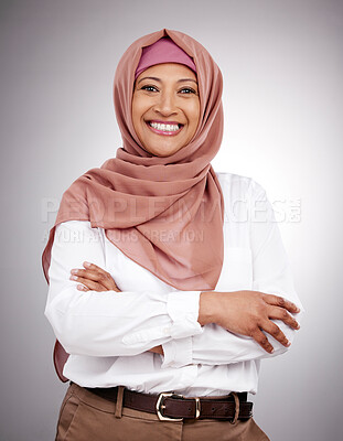 Buy stock photo Muslim, arms crossed and portrait and woman in studio with happiness, style and positive attitude. Hijab, islam and islamic fashion with a person on grey background for business and confidence