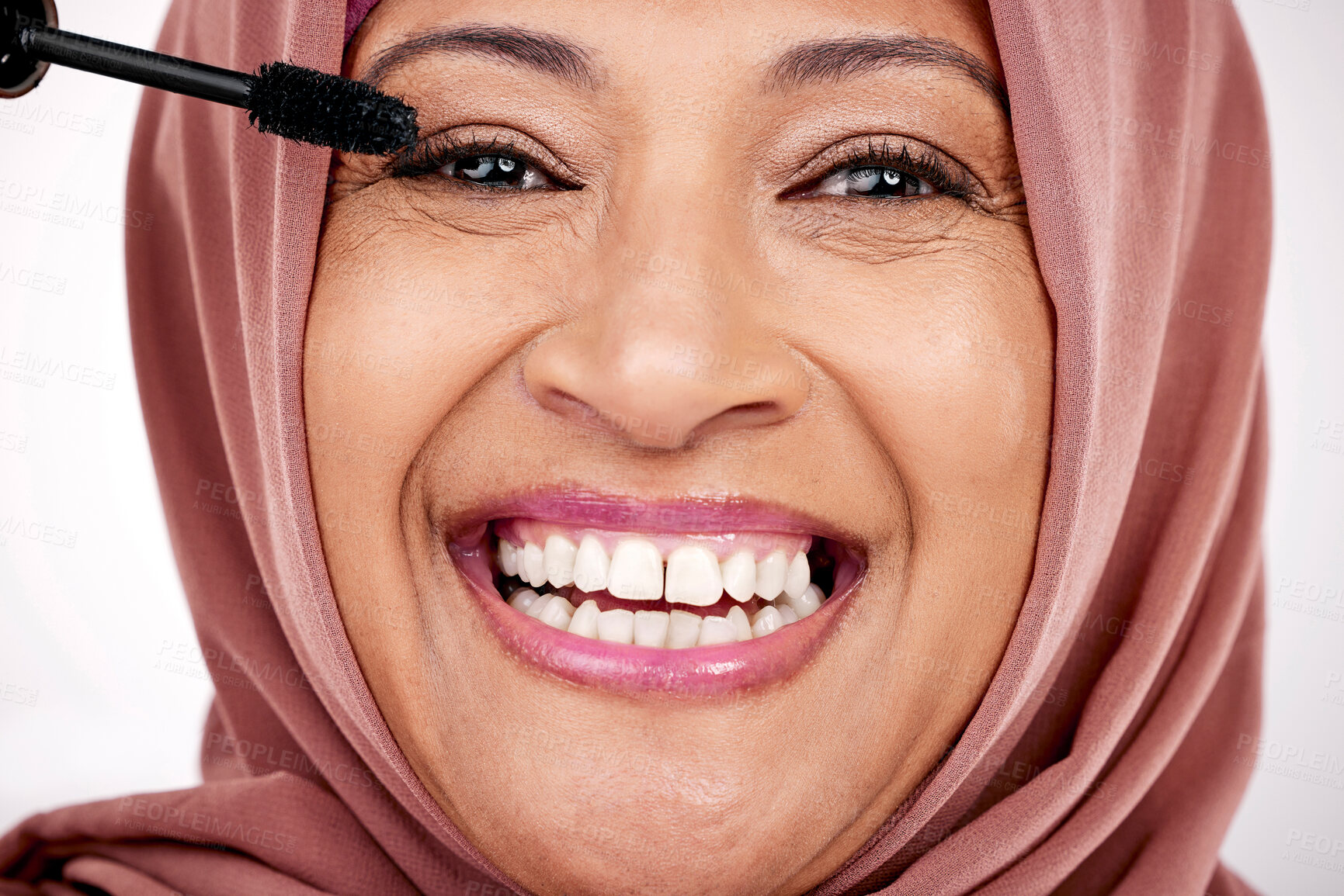 Buy stock photo Portrait, mascara brush and woman in hijab for facial beauty, skincare and cosmetics in studio with smile. Face of happy mature muslim model with eye makeup product, application and tools for lashes.