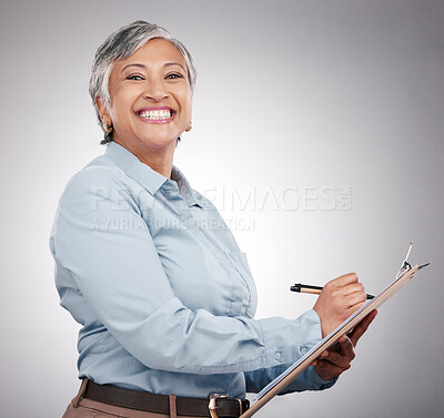 Buy stock photo Clipboard, writing and portrait of senior woman in a studio planning, brainstorming or working on a schedule. Happy, smile and elderly female model with paper list and pen isolated by gray background