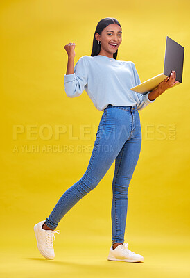 Buy stock photo Woman, student and winner on laptop for success, university news and e learning results or opportunity in studio. Person in college portrait with yes, wow or winning on computer and yellow background