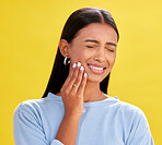 Dental, pain and woman in studio for toothache, problem and cavity crisis on yellow background space. Oral care, face and lady person with tooth, emergency or frustrated by sensitive teeth or decay