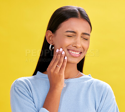 Buy stock photo Dental, pain and woman in studio for toothache, problem and cavity crisis on yellow background space. Oral care, face and lady person with tooth, emergency or frustrated by sensitive teeth or decay