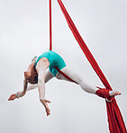 Aerial, woman gymnast and sport performance with stretching, flexibility and athlete with white background. Workout, exercise and gymnastics with balance, art and dance with acrobat competition