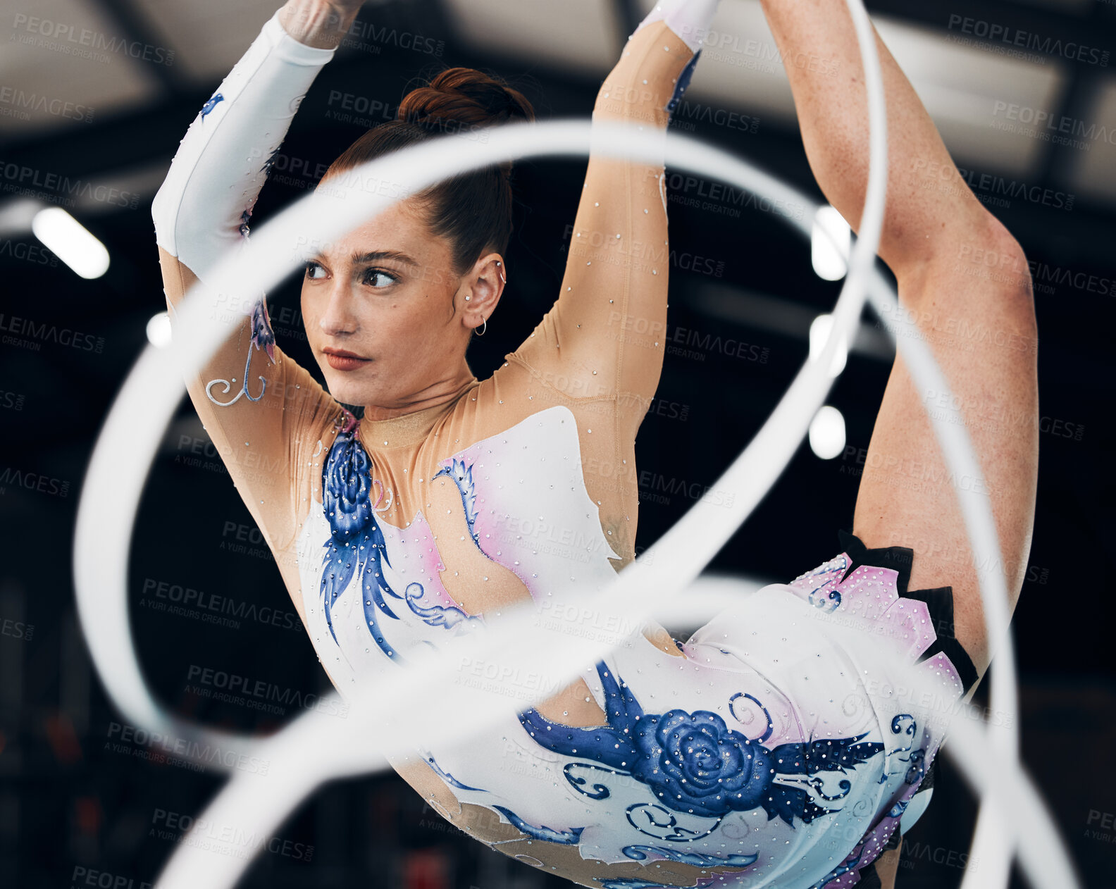 Buy stock photo Woman, ribbon gymnastics and dancing for sports performance, competition and concert in arena. Dancer, rhythm and creative training of athlete with talent, balance and flexibility for agile contest 