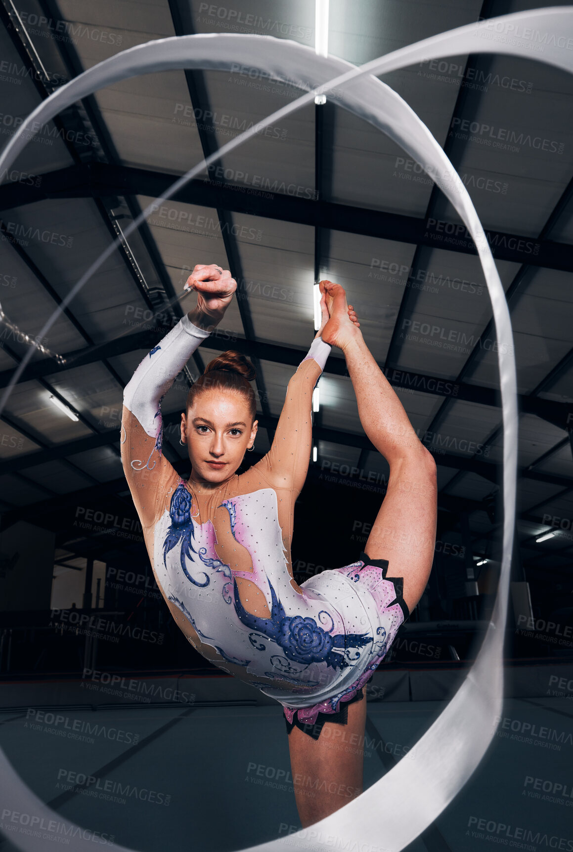 Buy stock photo Woman, portrait and balance for ribbon gymnastics in competition, performance or concert in dark arena. Flexible dancer, rhythm and agile athlete training with talent, creative contest or sports show