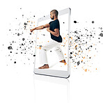 Tablet, karate and fitness app with a fighter man on a screen in studio isolated on a white background. Technology, training for self defense and color splash with a male athlete in a digital display