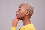 Thinking, smile and side profile of a black woman on a studio background for planning or vision. Happy, relax and face of an African girl or person with an idea, solution or knowledge on a backdrop