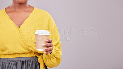 Buy stock photo Hand, coffee and mockup with a woman in studio on a gray background for morning caffeine in a cup. Cafe, space or takeaway beverage with a person closeup on empty or blank mock up for advertising