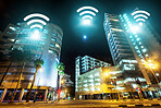 Cityscape, internet and night, wireless connectivity with building, technology abstract and communication online. Location, connection and urban street landscape, cyber and digital transformation