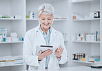 Happy senior woman, pharmacist and tablet in research, inventory inspection or checking stock at drugstore. Mature female person, medical or healthcare on technology in pharmaceuticals at pharmacy