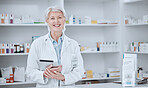 Pharmacy, tablet and portrait of woman pharmacist in dispensary, clinic or hospital for medicine with smile. Medical, healthcare and senior professional doctor or drug store manager working online