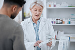 Senior woman, pharmacist and customer in consultation for medication or prescription at drugstore. Mature female person, medical or healthcare employee with patient and pharmaceuticals at pharmacy