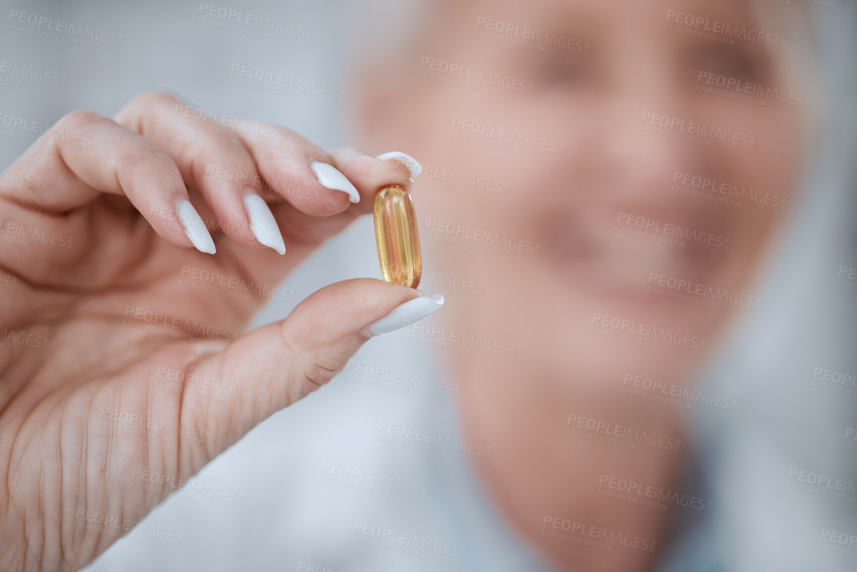 Buy stock photo Hand, pill and healthcare with a medicine professional holding a vitamin or supplement closeup in a pharmacy. Tablet, medical and pharmaceutical with a pharmacist in a clinic to recommend a cure