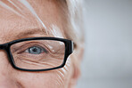 Eye, old woman and glasses for vision and lens, mockup space and optometry with closeup of health and glaucoma. Prescription eyewear with sight and eyecare, wellness and wrinkles with frame and help