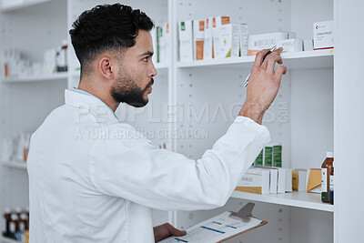 Buy stock photo Man, pharmacist and inventory inspection on shelf in checking stock, medication or pills at pharmacy. Male person, medical or healthcare professional reading pharmaceutical product, drug or checklist