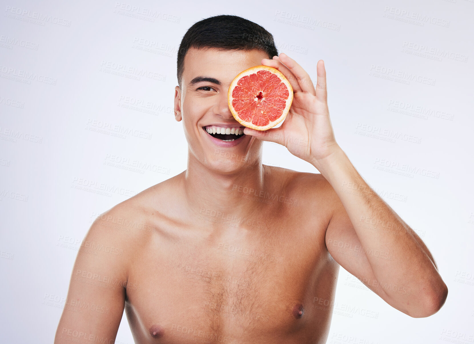 Buy stock photo Beauty, grapefruit and health with portrait of man in studio for skincare, detox and natural cosmetics. Vitamin c, nutrition and spa with person and fruit on white background for self care and glow 