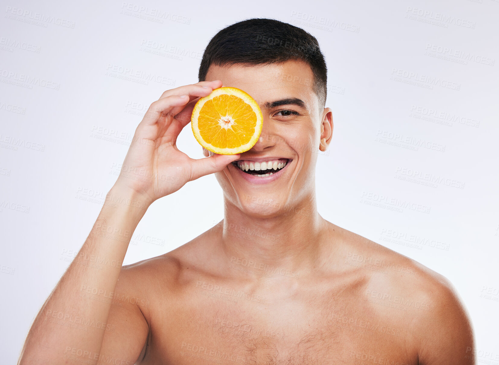 Buy stock photo Beauty, orange and smile with portrait of man in studio for health, skincare and natural cosmetics. Vitamin c, nutrition and summer with face of person and fruit on white background for self care