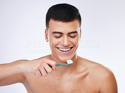 Buy stock photo Happy man, toothbrush and dental care in hygiene, grooming or brushing teeth against a white studio background. Male person with big smile or toothpaste in tooth whitening, cleaning or oral treatment