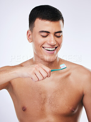 Buy stock photo Happy man, toothbrush and cleaning teeth in dental care hygiene or grooming against a white studio background. Male person smile with toothpaste for tooth whitening, oral or gum and mouth treatment