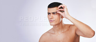 Buy stock photo Man, grooming and clean skincare with facial and beauty treatment for skin and wellness in studio. Male model, dermatology and hair removal tool of eyebrows with grey background and mockup space