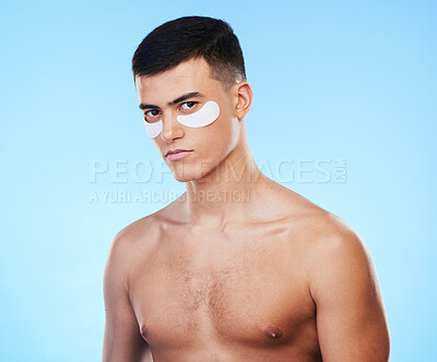 Buy stock photo Man, beauty and portrait with eye patch for skincare, grooming and clean with hygiene on blue background. Skin treatment, cosmetics product and wellness, self care and dermatology in a studio