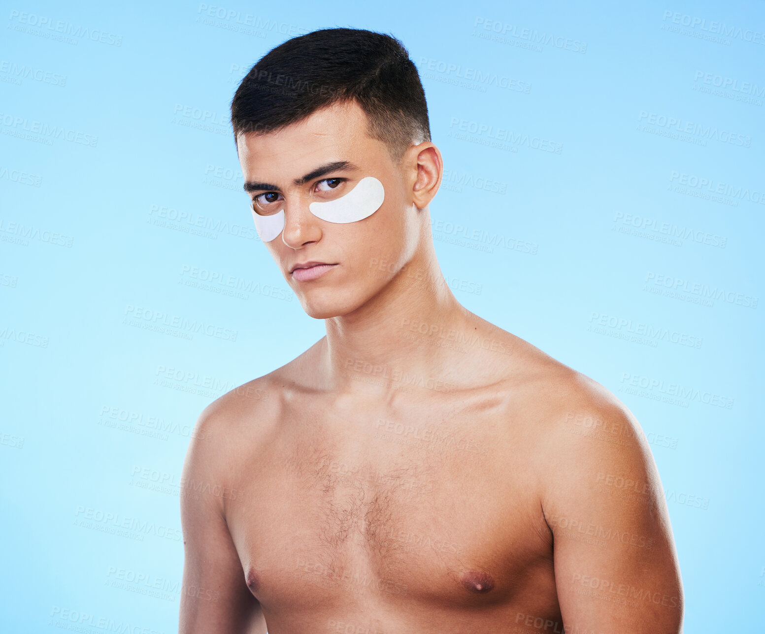 Buy stock photo Man, beauty and portrait with eye patch for skincare, grooming and clean with hygiene on blue background. Skin treatment, cosmetics product and wellness, self care and dermatology in a studio