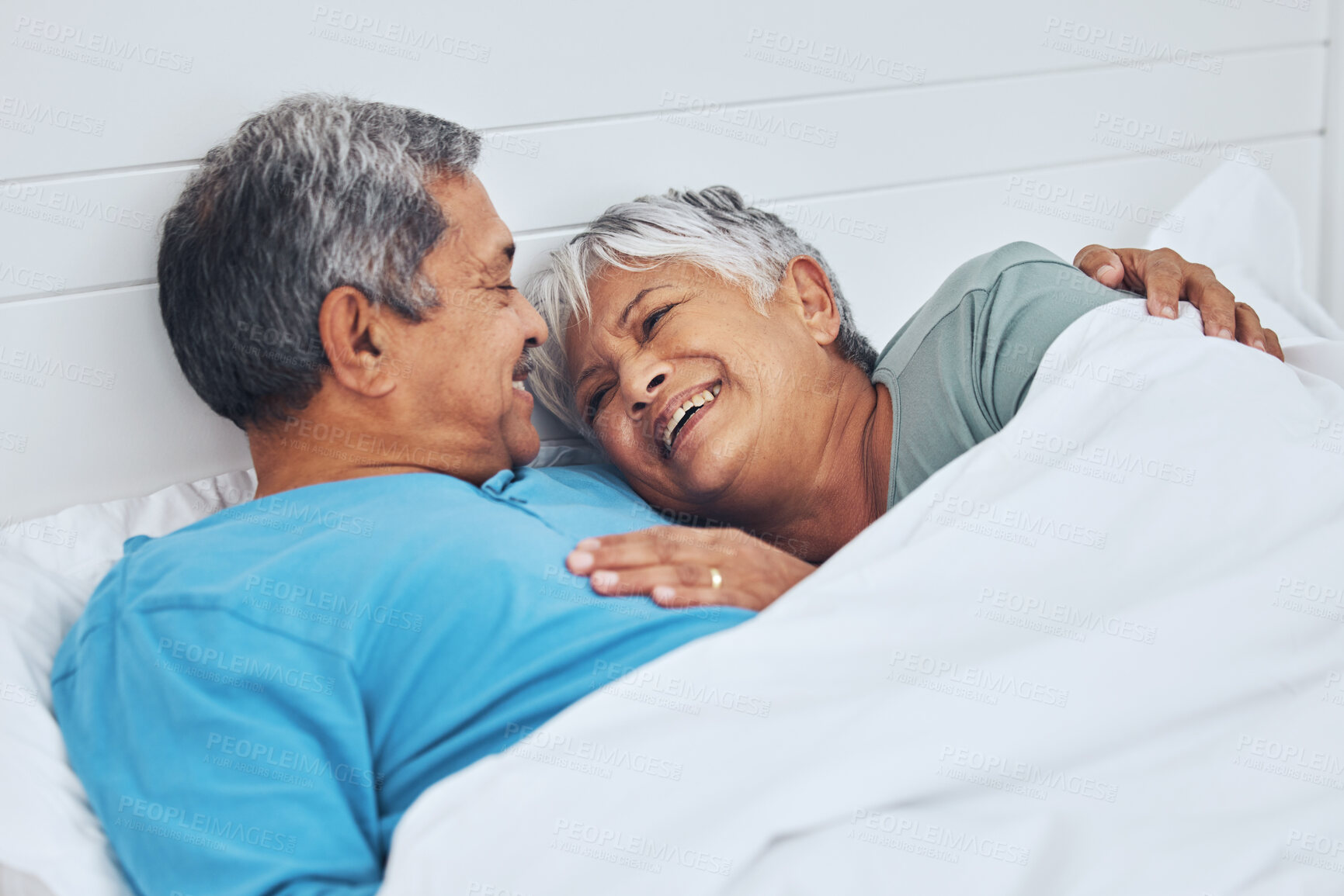 Buy stock photo Bed, smile and senior couple with love, relax and marriage with retirement, relationship and conversation. Morning, elderly man and old woman with romance, bedroom and trust with peace, home and care