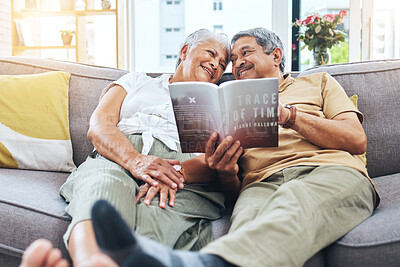 Buy stock photo Senior, relax and a couple reading a book on the sofa for learning together. Smile, love and an elderly man and woman with a novel or story on a home living room couch for knowledge in retirement