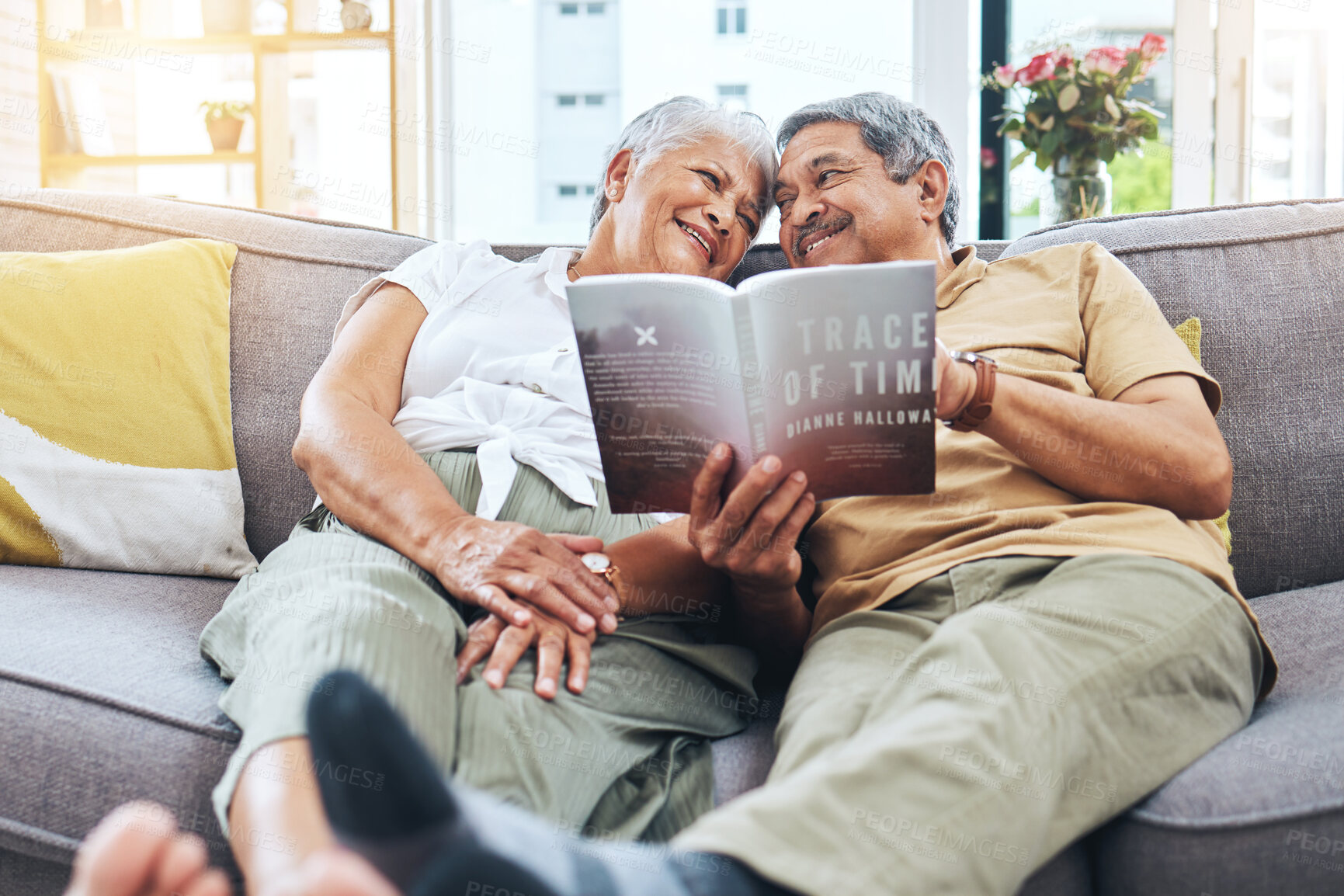 Buy stock photo Senior, relax and a couple reading a book on the sofa for learning together. Smile, love and an elderly man and woman with a novel or story on a home living room couch for knowledge in retirement