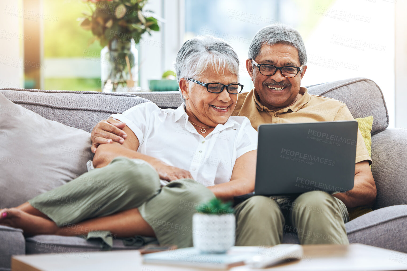 Buy stock photo Laptop, happy and senior couple on sofa for watching movies, entertainment and streaming in living room. Retirement, love and man and woman relax on computer for internet, website and online at home