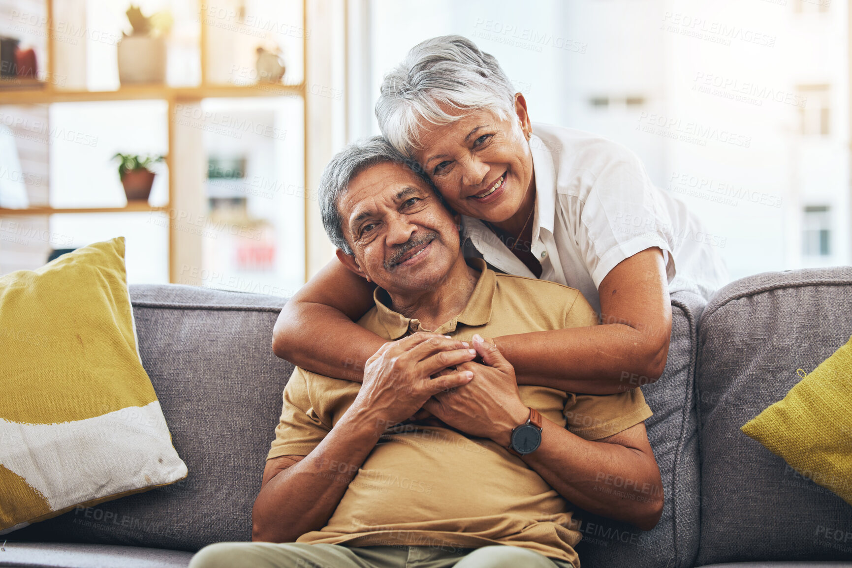 Buy stock photo Portrait, hug and senior couple on sofa for bonding, healthy marriage and relationship in living room. Retirement, love and happy man and woman on couch embrace for trust, commitment and care at home