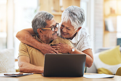 Buy stock photo Laptop, senior couple and hug at table in home, bonding and care together on social media. Computer, embrace and elderly man and woman happy, smile and connection to support, love and typing email