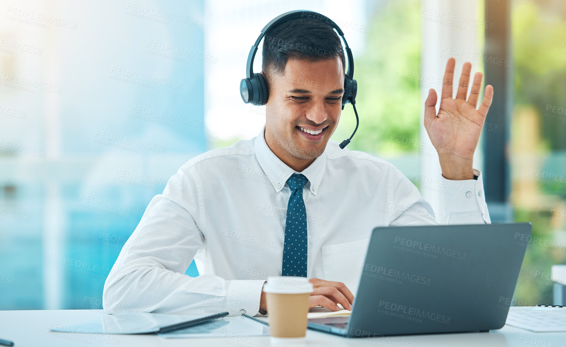 Buy stock photo Call center, laptop and man wave in video in customer service, support or help desk office. Happy, hello and sales agent in webinar communication, consulting and telemarketing in online conference